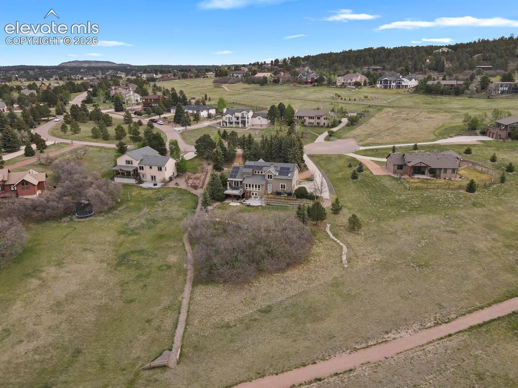 Image 6 of 41: Aerial view illustrating the home’s placement on a spacious lot with surrou