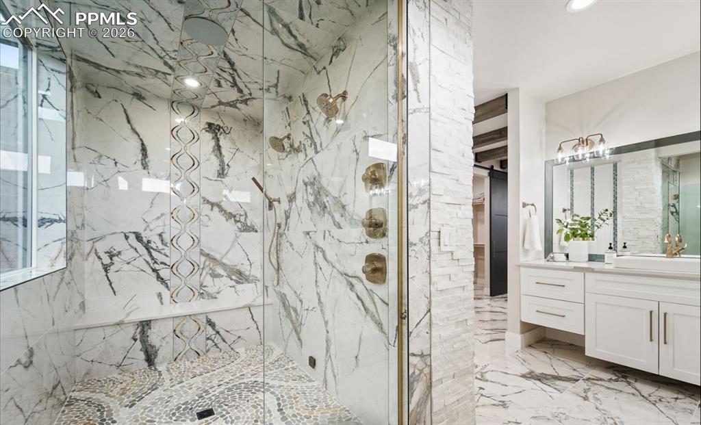 Image 21 of 50: This enclosed steam shower hosts dual heads, sprayer, and built-in speakers