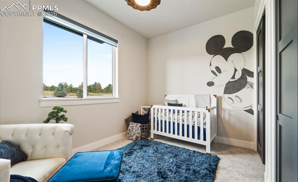 Image 23 of 50: Welcome to the nursery / first floor bedroom.