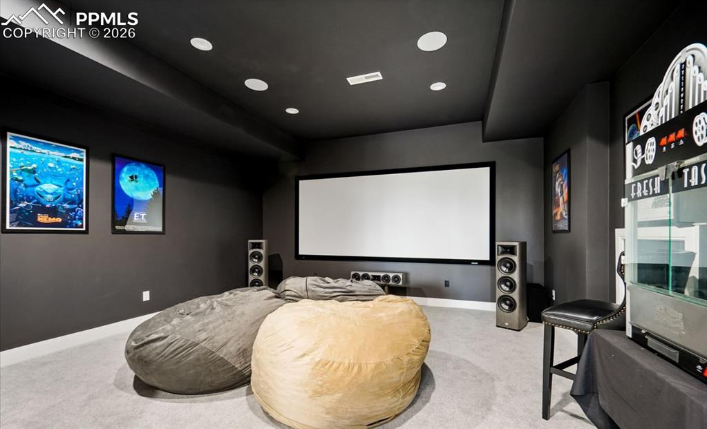 Image 31 of 50: The media room offers a 125-inch projector screen.