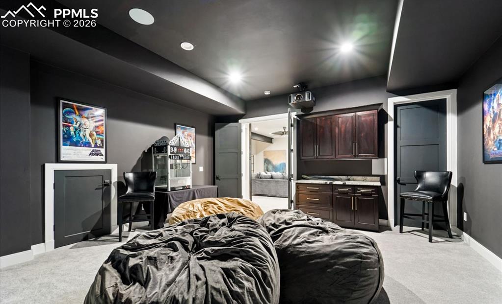 Image 32 of 50: This space includes 7.2 surround sound, beanbags included, enclosed server 