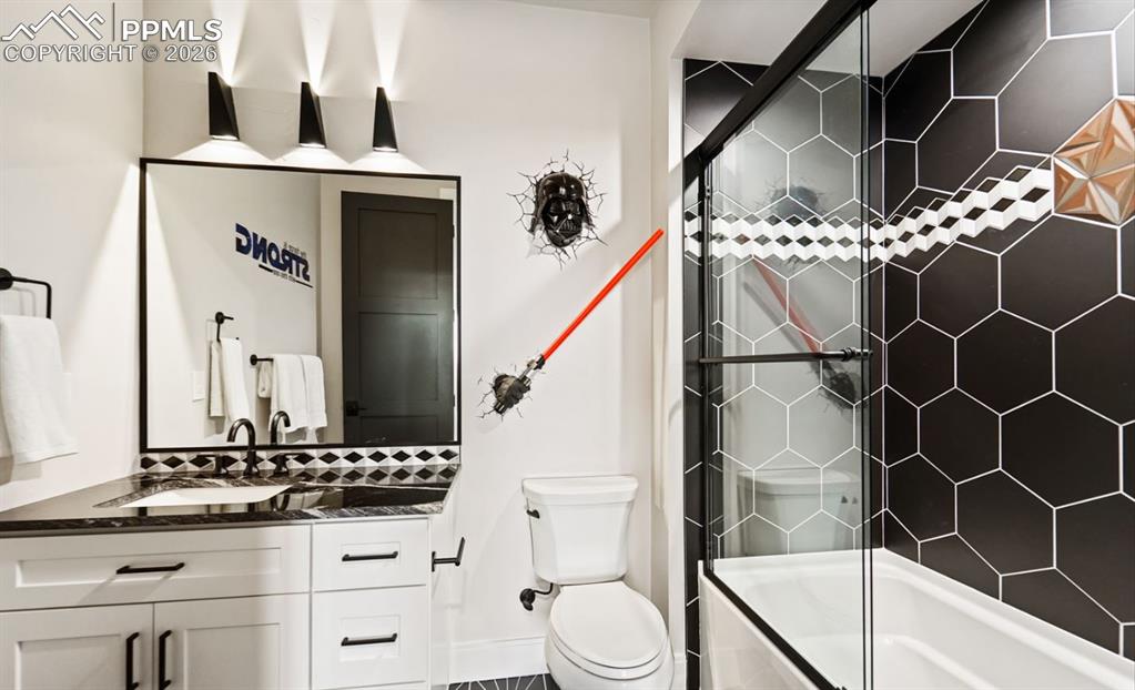Image 39 of 50: This full bathroom captures the Star Wars theme with inspired tilework and 