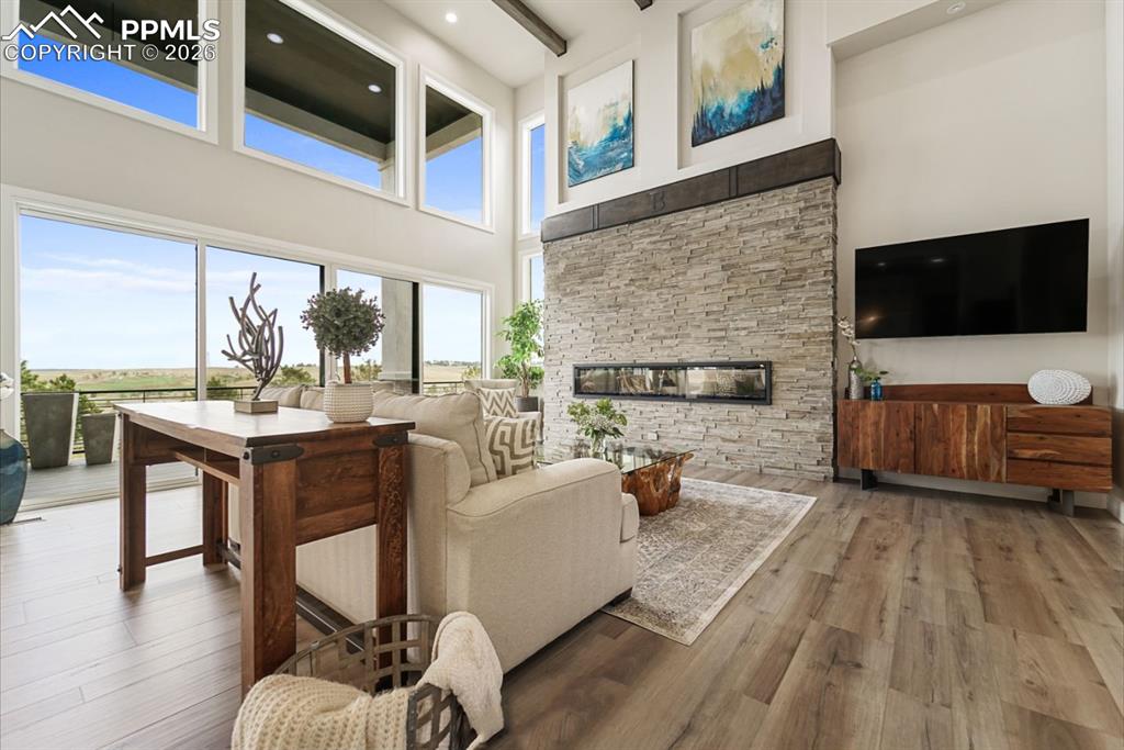 Image 6 of 50: Picture Windows perfectly illuminate this grand living room. 