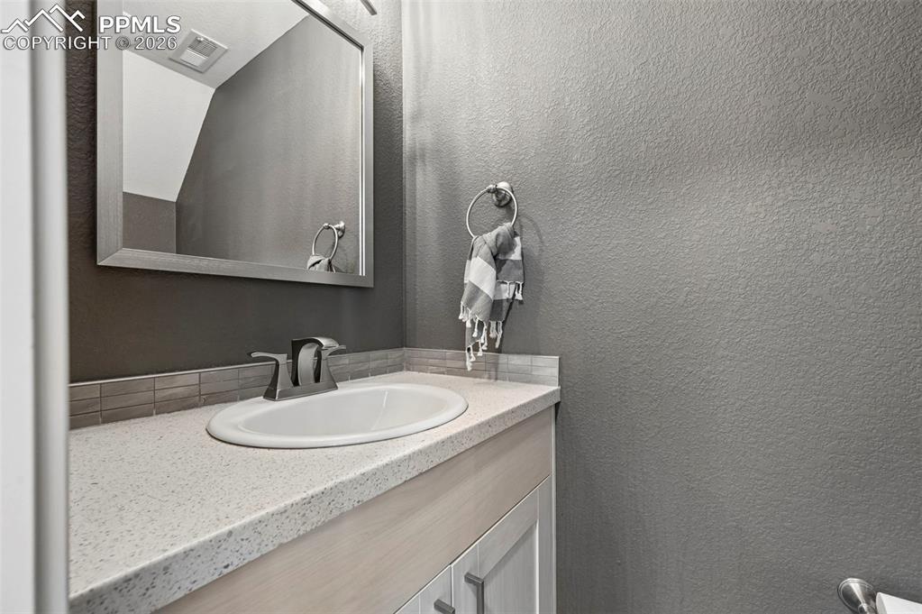 Image 16 of 34: 1/2 Bath on lower level