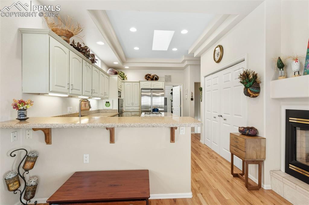 Image 12 of 50: Dining room is open to the kitchen!