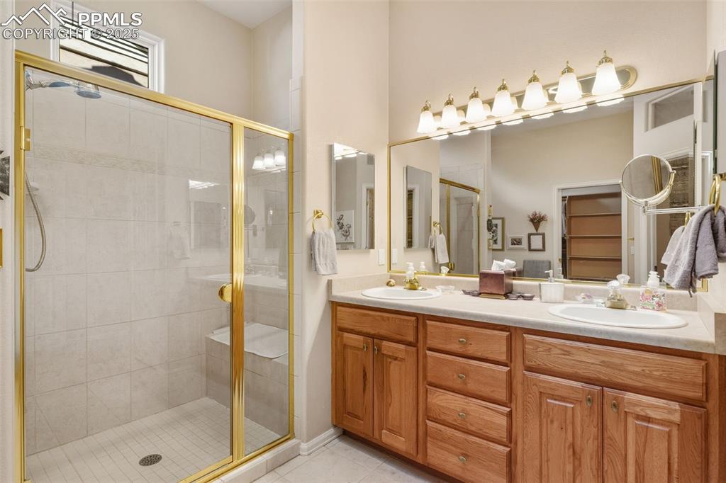 Image 23 of 50: Double vanities. stand-alone shower with seat