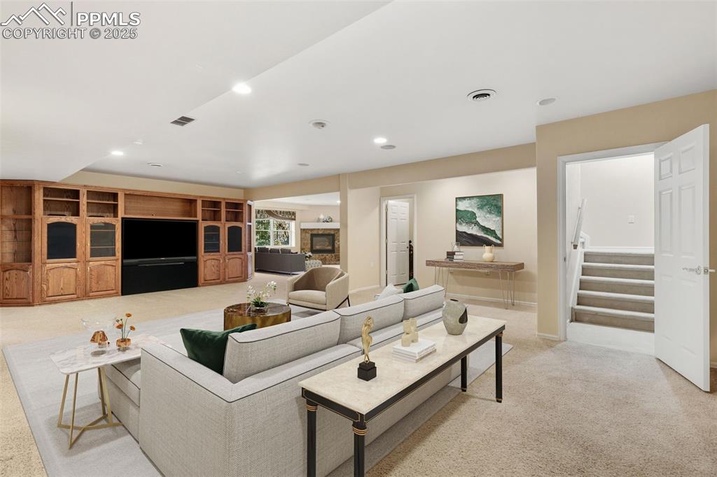 Image 32 of 50: VIRTUAL STAGED DOWNSTAIRS FAMILY ROOM