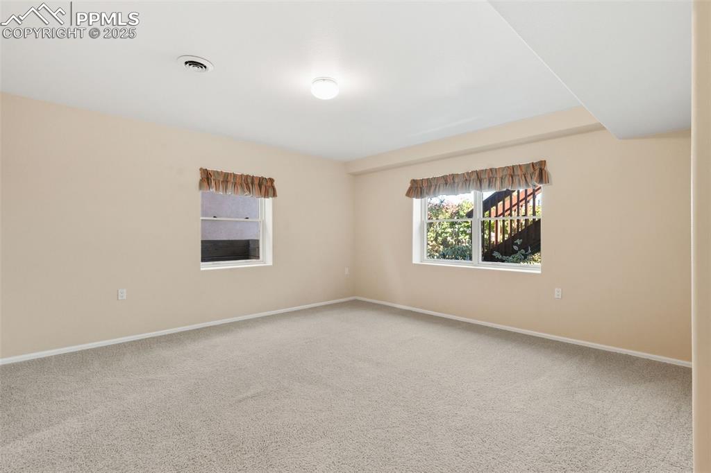 Image 40 of 50: Downstairs bedroom