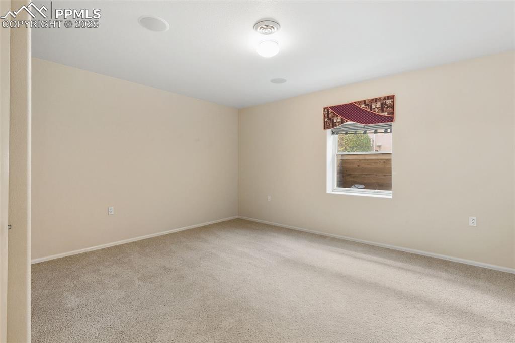 Image 43 of 50: Downstairs bedroom