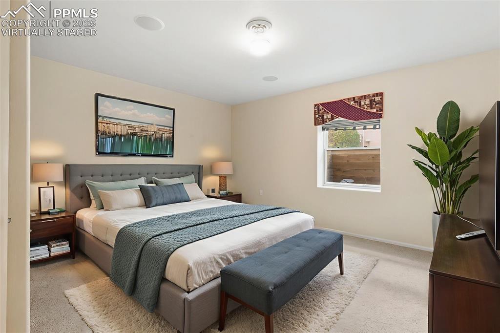 Image 44 of 50: VIRTUALLY STAGED DOWNSTAIRS BEDROOM