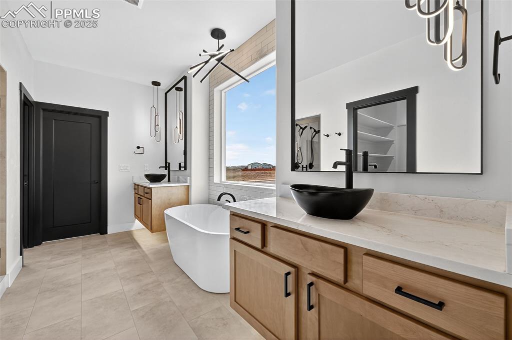 Image 16 of 42: Main Bedroom suite bathroom with heated floors.