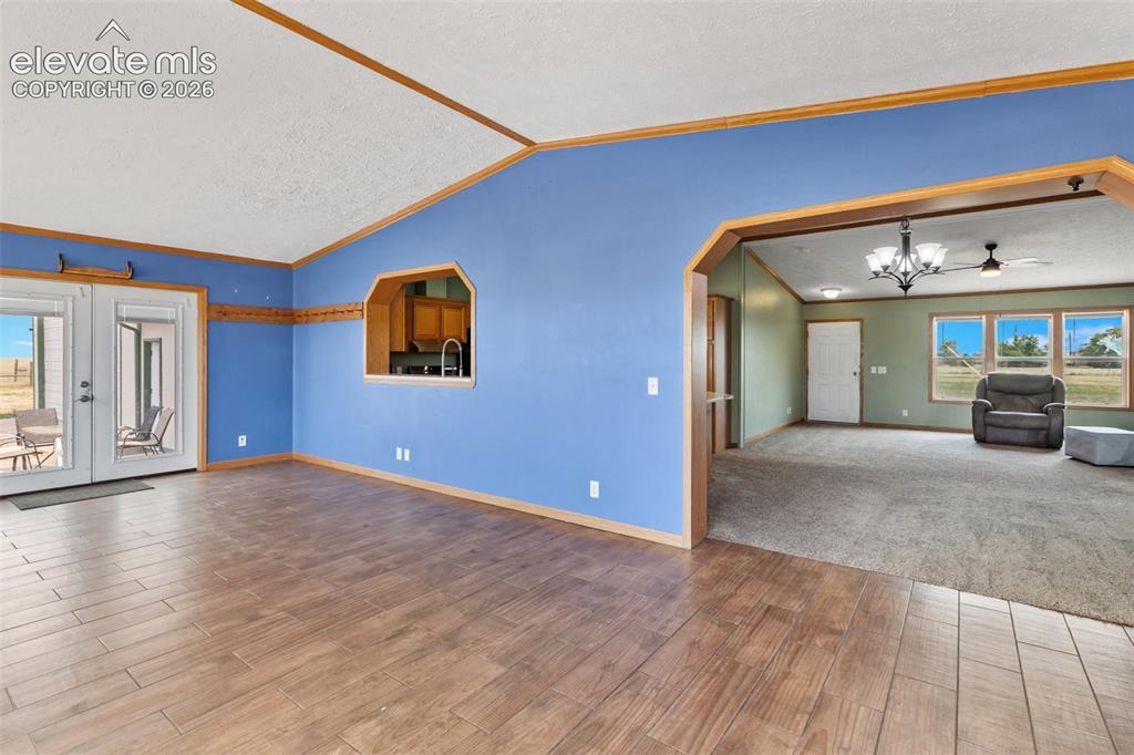 Image 10 of 45: Front entrance into great room