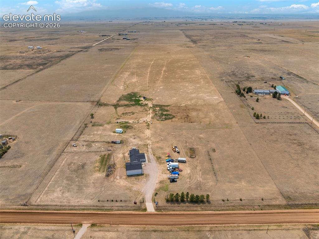 Image 44 of 45: Expansive rural property featuring a newly constructed residence with a dar