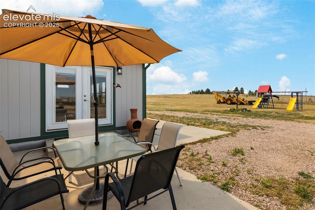 Image 9 of 45: Concrete patio area featuring direct outdoor access