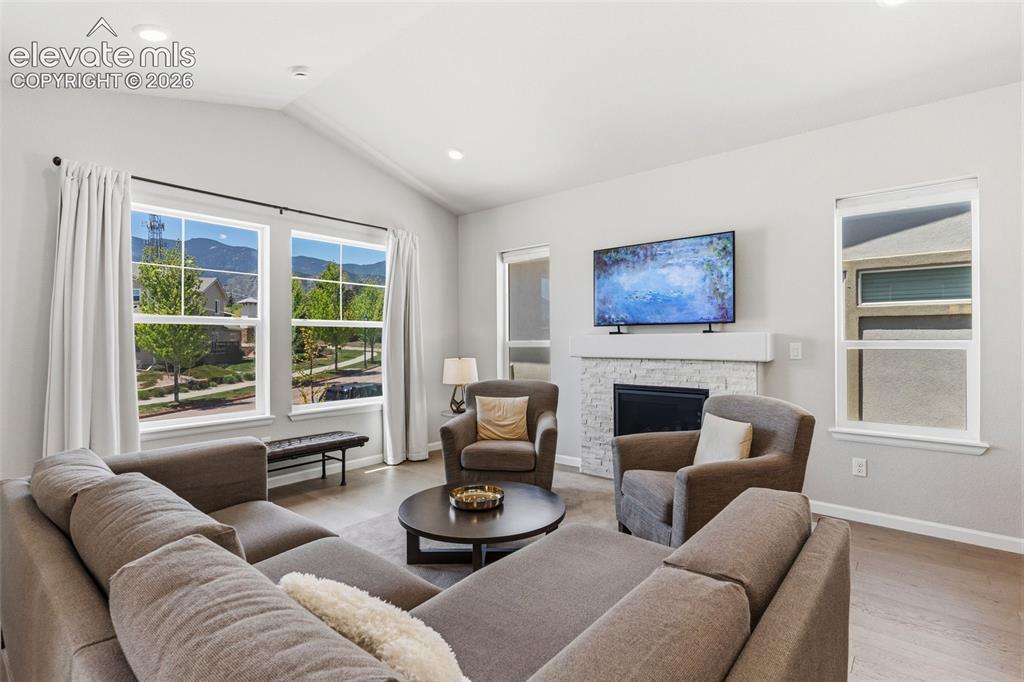 Image 14 of 41: Bright living space with vaulted ceilings