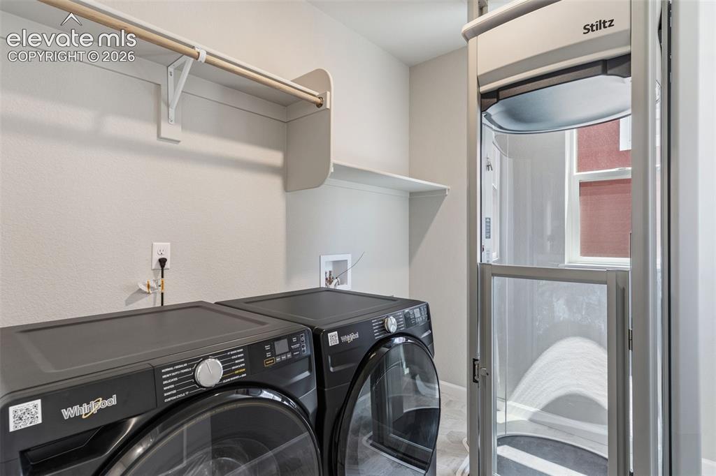 Image 18 of 41: Elevator to garage from laundry room