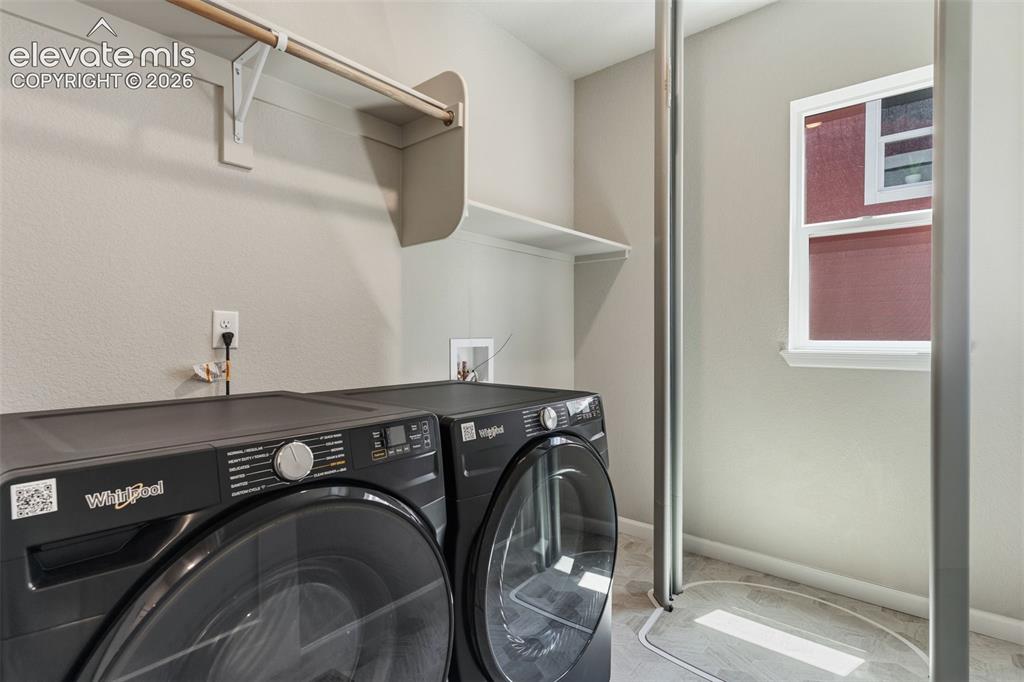 Image 19 of 41: laundry room with elevator at lower level