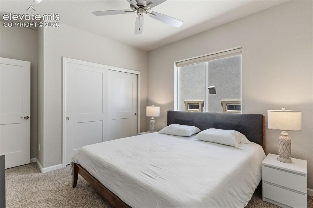 Image 30 of 41: Bedroom featuring neutral-toned walls, textured carpet flooring, and a ceil