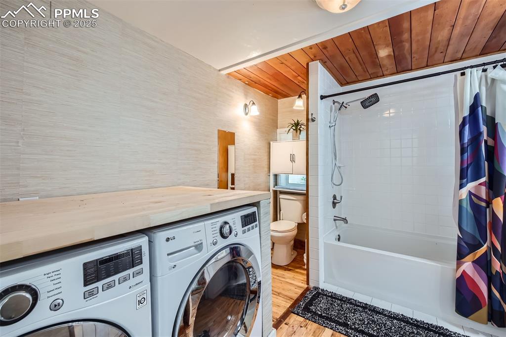 Image 10 of 20: Laundry inside of bathroom