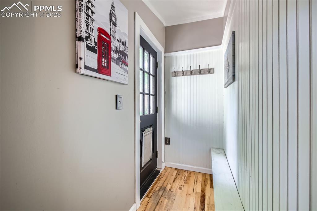 Image 16 of 20: Mud room featuring light wood-type flooring and baseboards