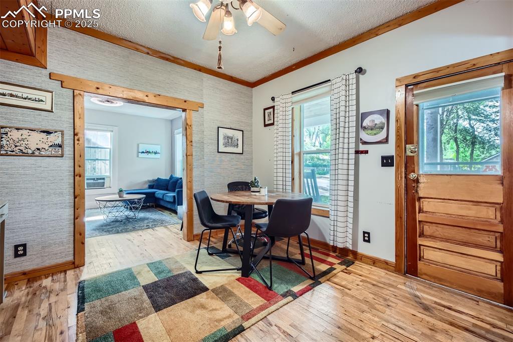 Image 3 of 20: Dining area with baseboards, light wood-type flooring, plenty of natural li