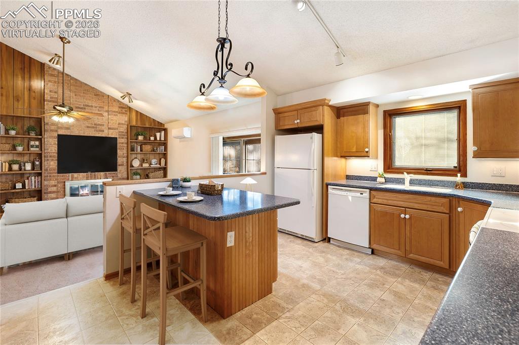 Image 17 of 42: Kitchen into family room Virtually Staged