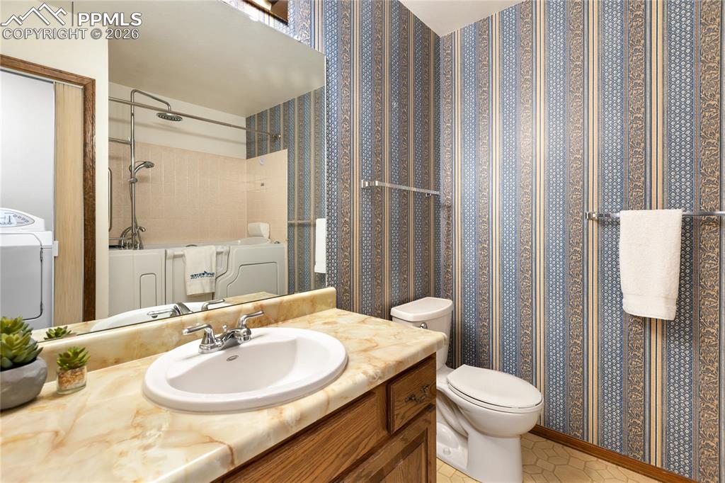 Image 28 of 42: Main level Hall Bath