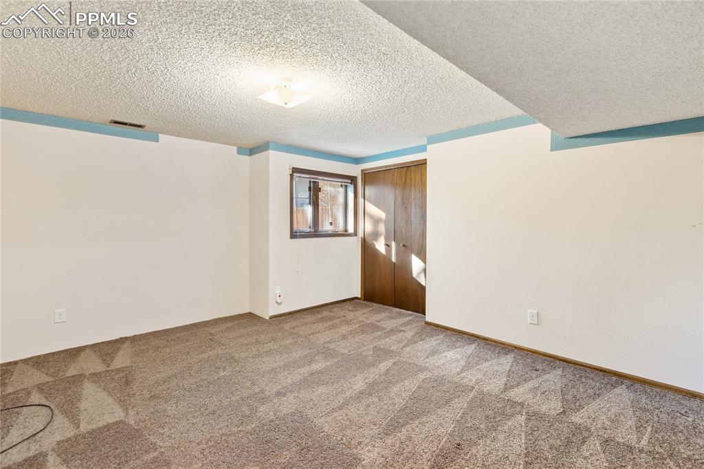 Image 31 of 42: Basement 3rd bedroom with garden level window