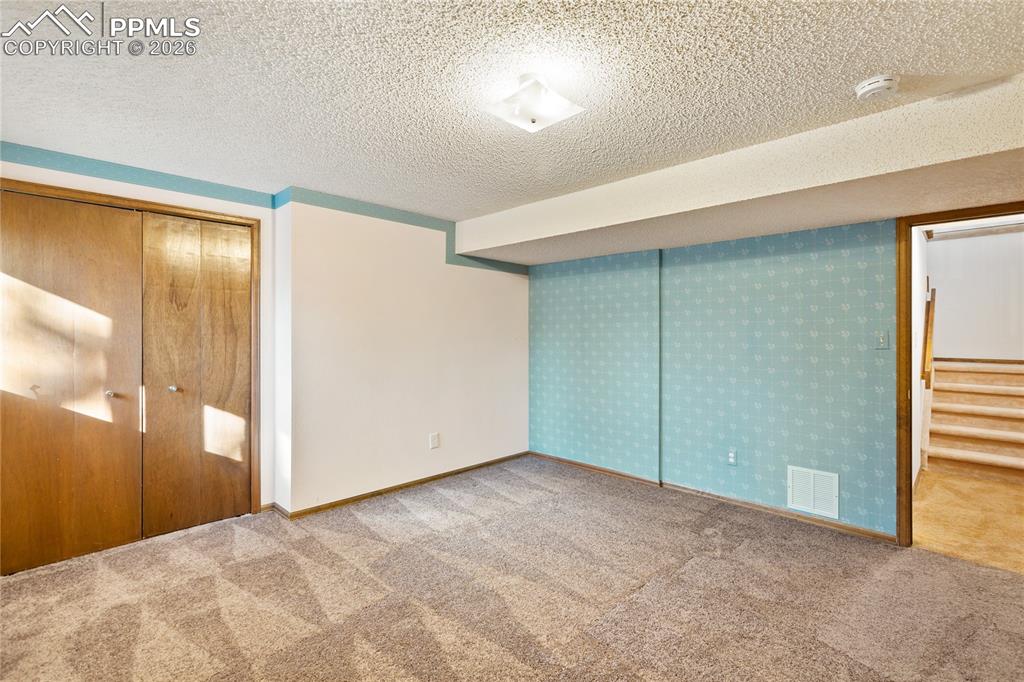 Image 32 of 42: Basement level 3rd bedroom