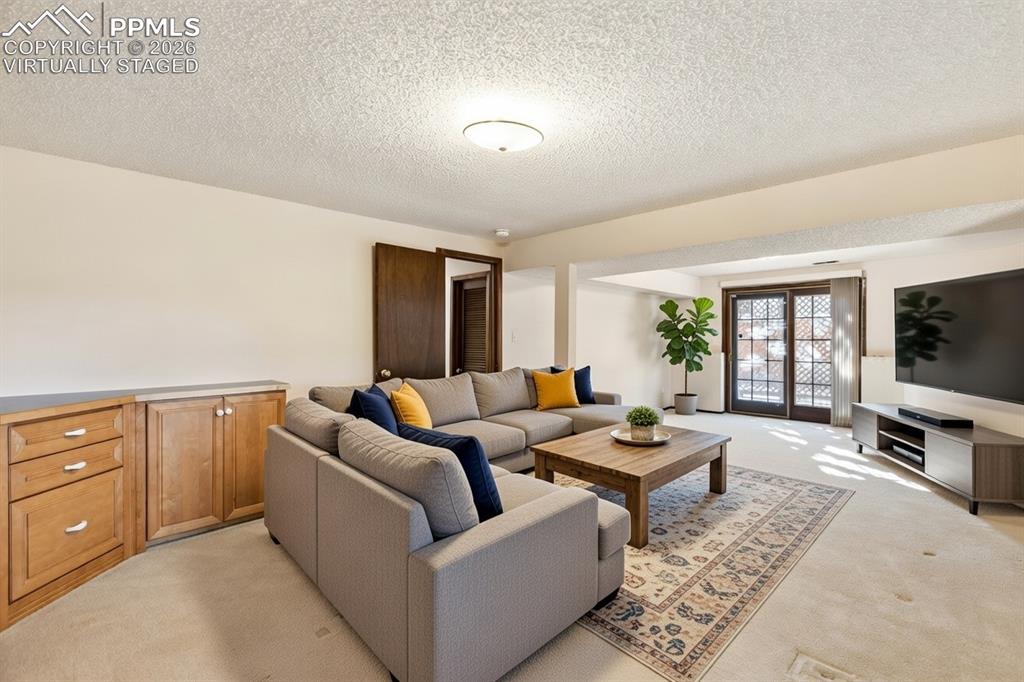 Image 36 of 42: Basement Family Room Virtually Staged