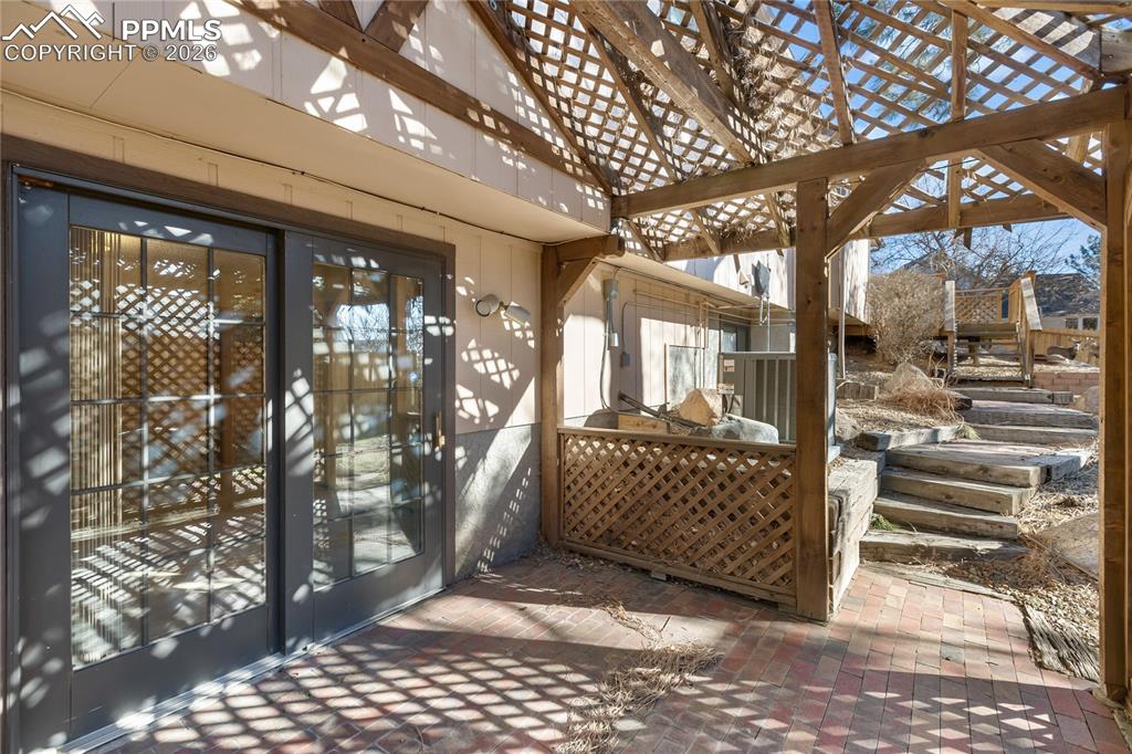 Image 4 of 42: Deck off of Main Level Family Room.