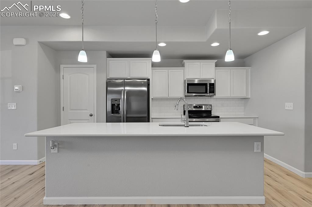 Image 14 of 46: Kitchen featuring appliances with stainless steel finishes, recessed lighti