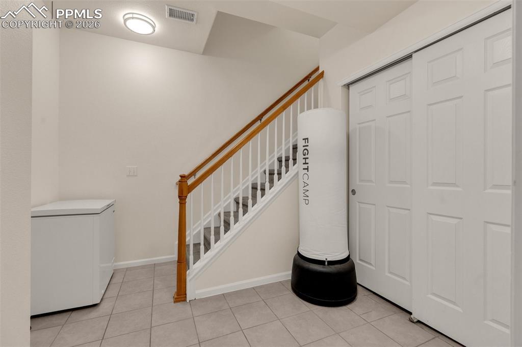 Image 27 of 39: Carpeted bedroom with ceiling fan, and vaulted ceiling