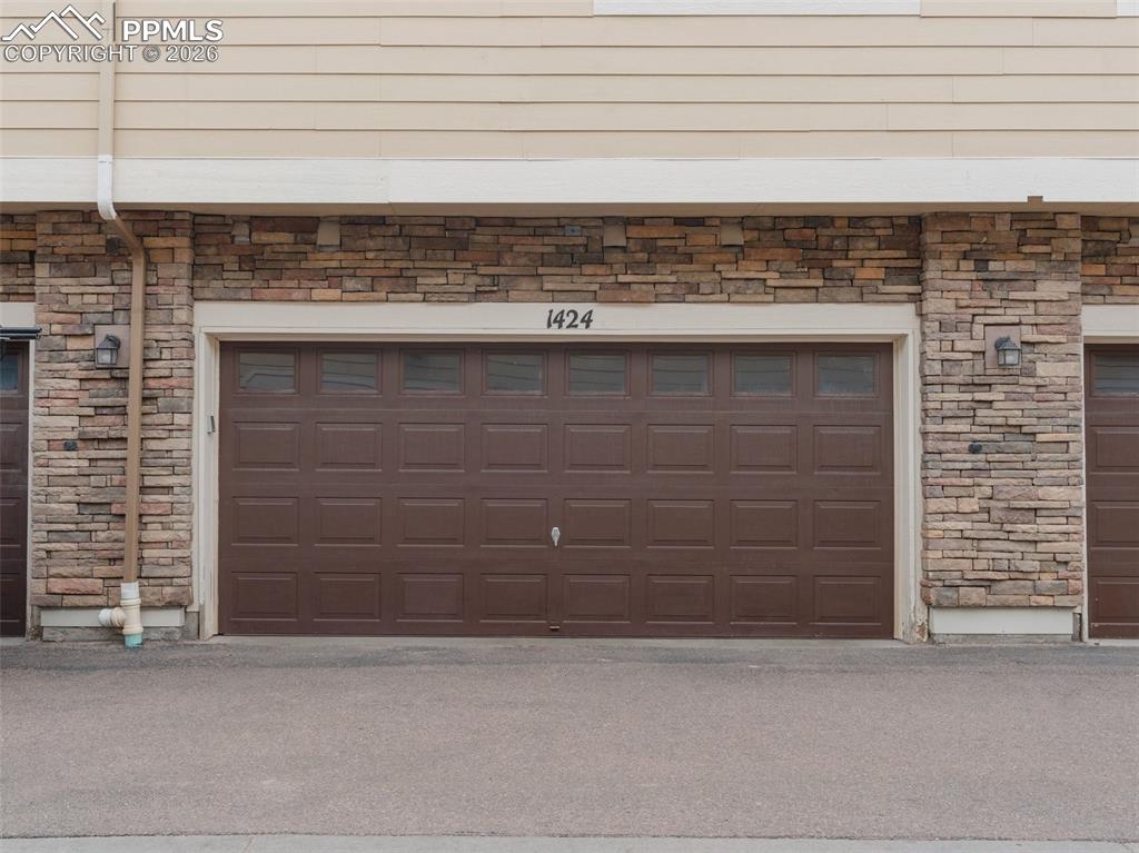 Image 30 of 39: Staircase featuring baseboards and tile patterned flooring
