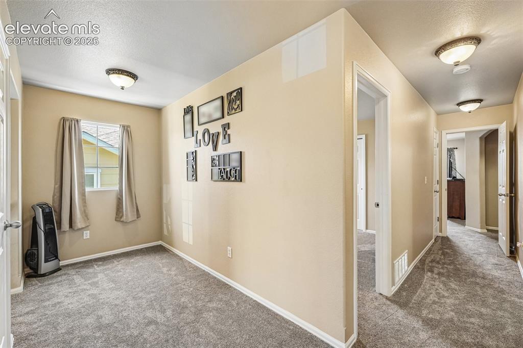 Image 12 of 29: expaned landing/loft area at the top of the stairs