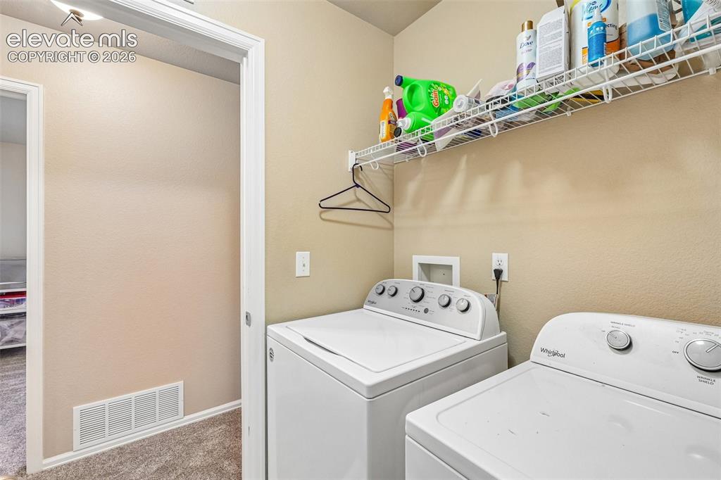 Image 20 of 29: Spacious laundry room