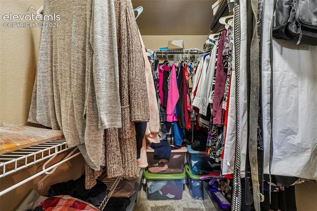 Image 24 of 29: large Primary walk in closet