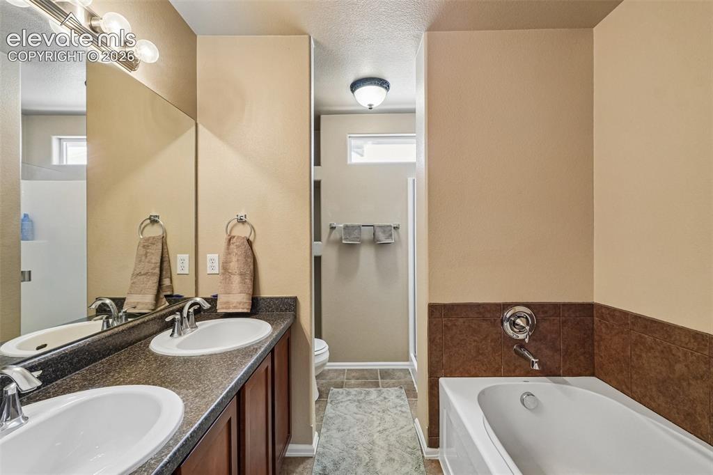 Image 25 of 29: 5 piece primary bathroom