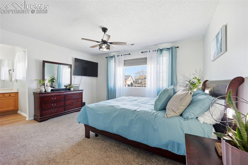 Image 14 of 42: Primary Bedroom with En-Suite Bathroom
