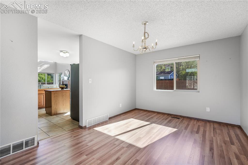 Image 11 of 50: Dining area with direct access into kitchen