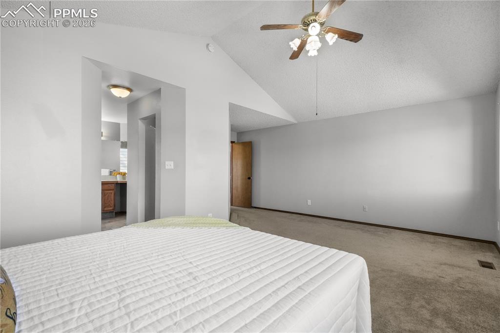 Image 26 of 50: Upstairs primary bedroom with ensuite 5 piece bath and large walk in closet