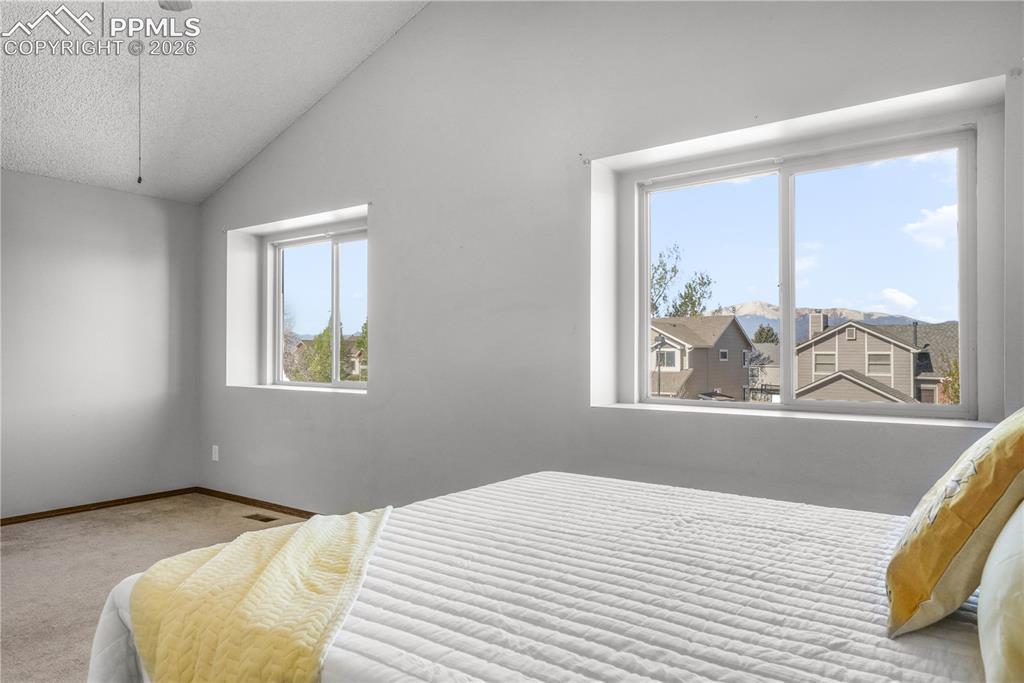 Image 27 of 50: Upstairs primary bedroom with ensuite 5 piece bath and large walk in closet