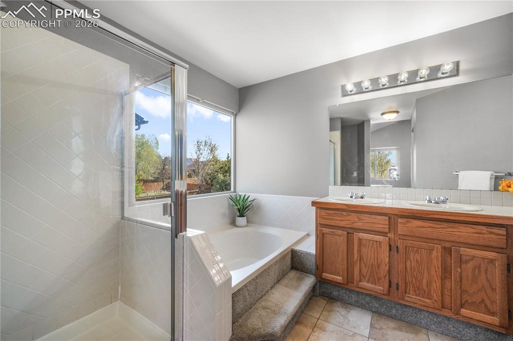 Image 28 of 50: Upstairs primary ensuite 5 piece bath and large walk in closet