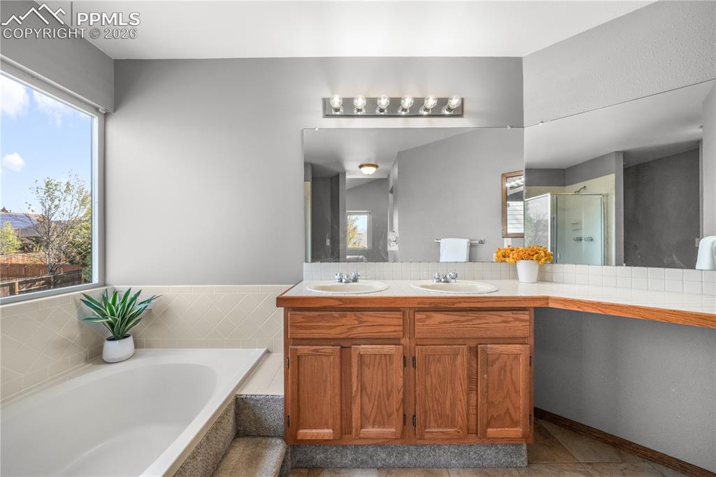 Image 29 of 50: Upstairs primary ensuite 5 piece bath and large walk in closet