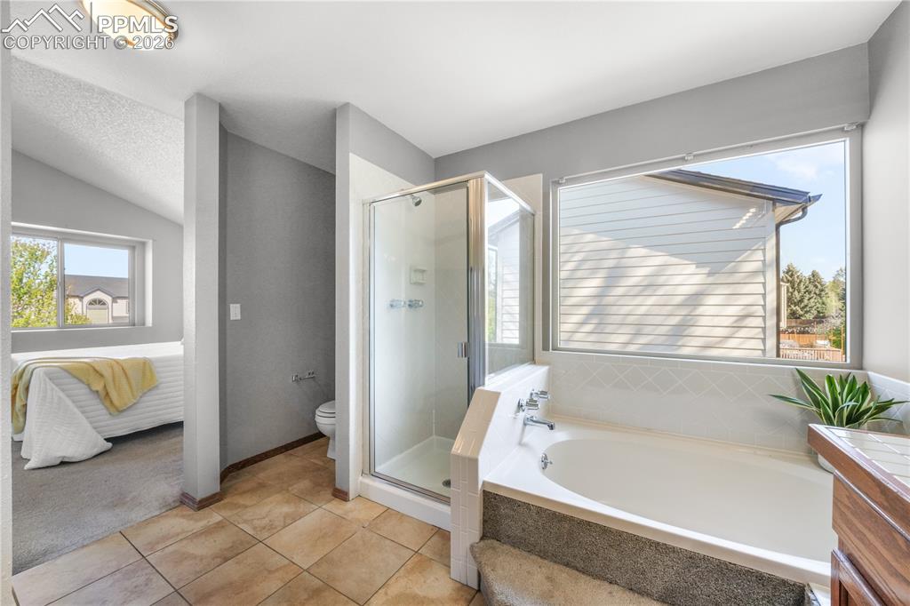 Image 30 of 50: Upstairs primary ensuite 5 piece bath and large walk in closet