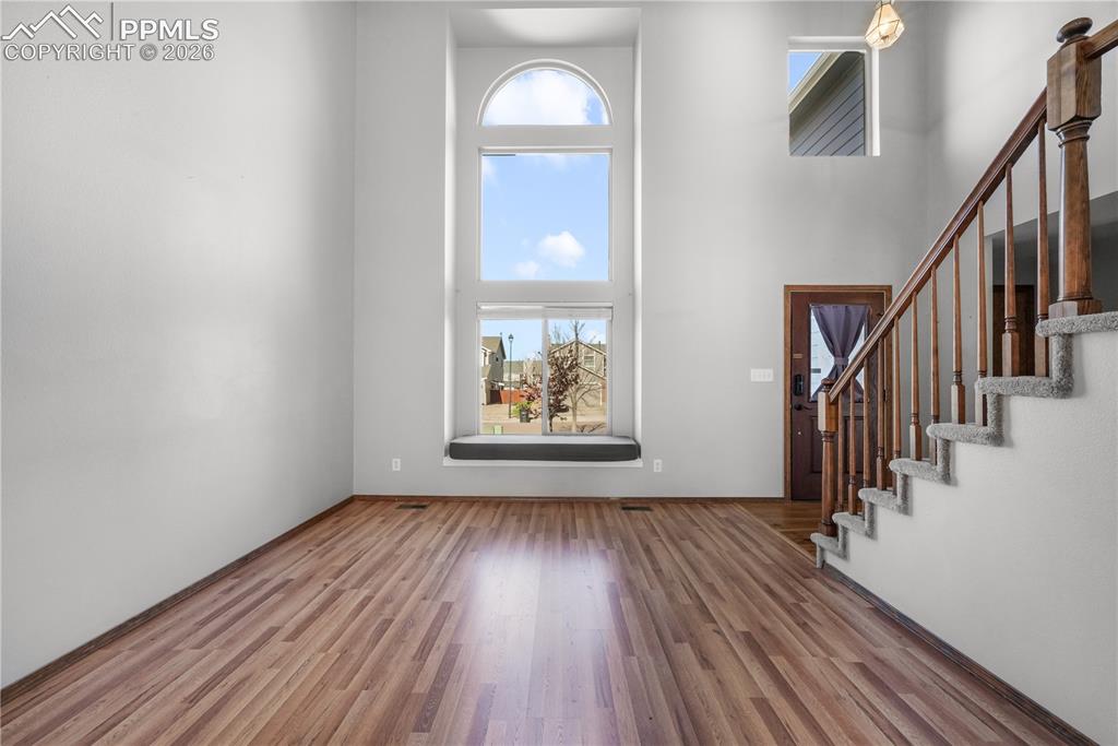 Image 7 of 50: Front entry, formal sitting room and vaulted ceilings with abundant natural