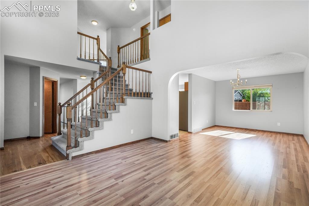 Image 8 of 50: Front entry, formal sitting room and views of dining room