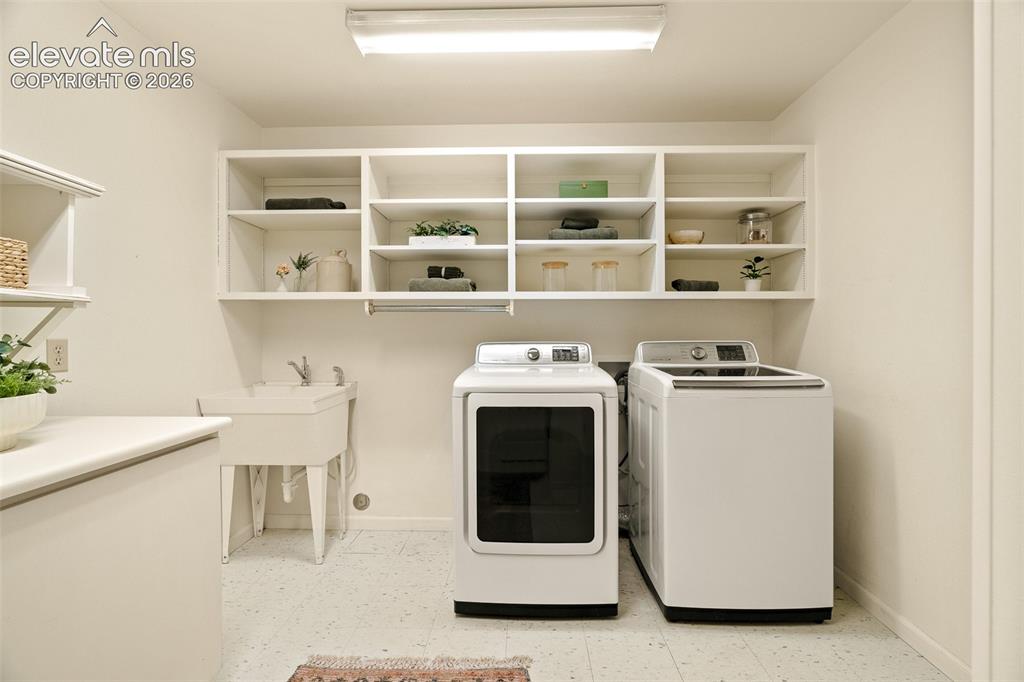 Image 33 of 50: Basement laundry room photographed June 2026