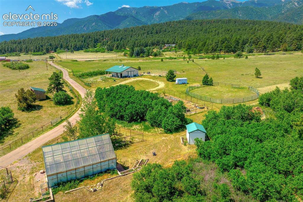Image 36 of 50: View of greenhouse and other outbuildings photographed June 2026