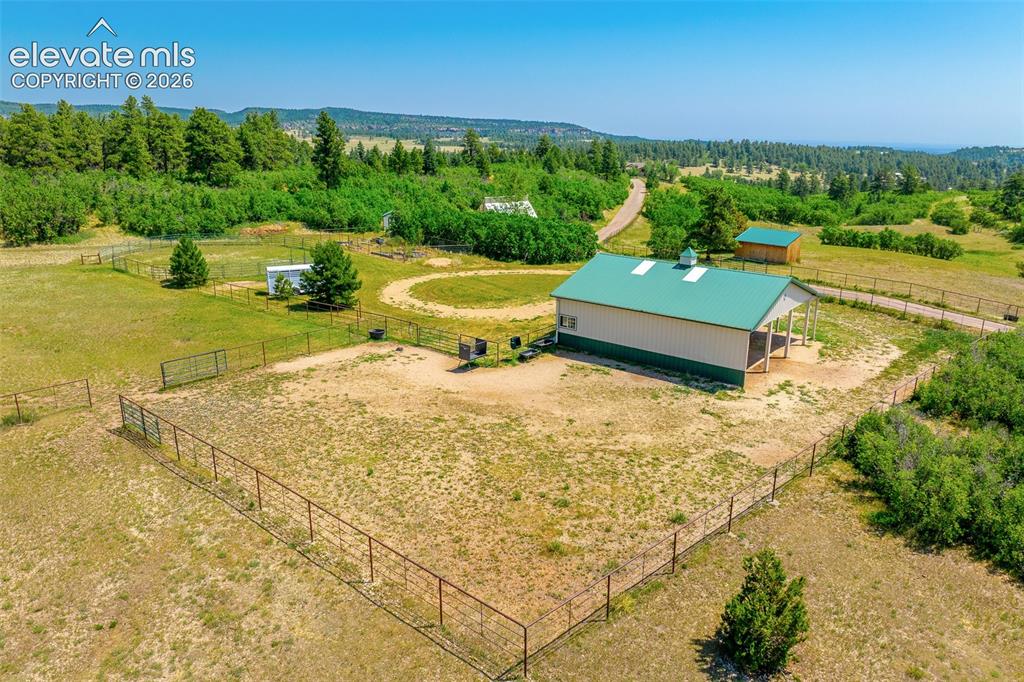 Image 38 of 50: View of stable and pasture photographed June 2026